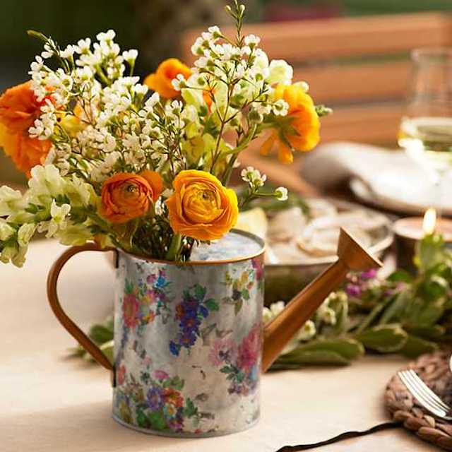 watering can with flowers